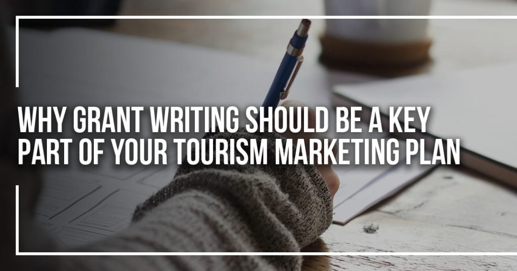 Why grant writing should be a key part of your tourism marketing plan written over a photo of someone writing with a pen.